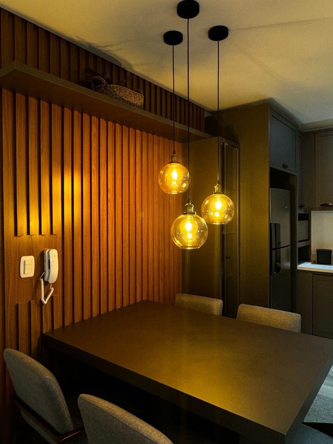 Slatted timber wall and bar with pendant lighting