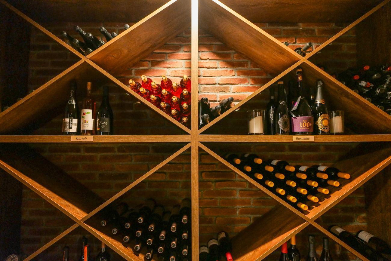 Wine room with diamond bin racking in oak