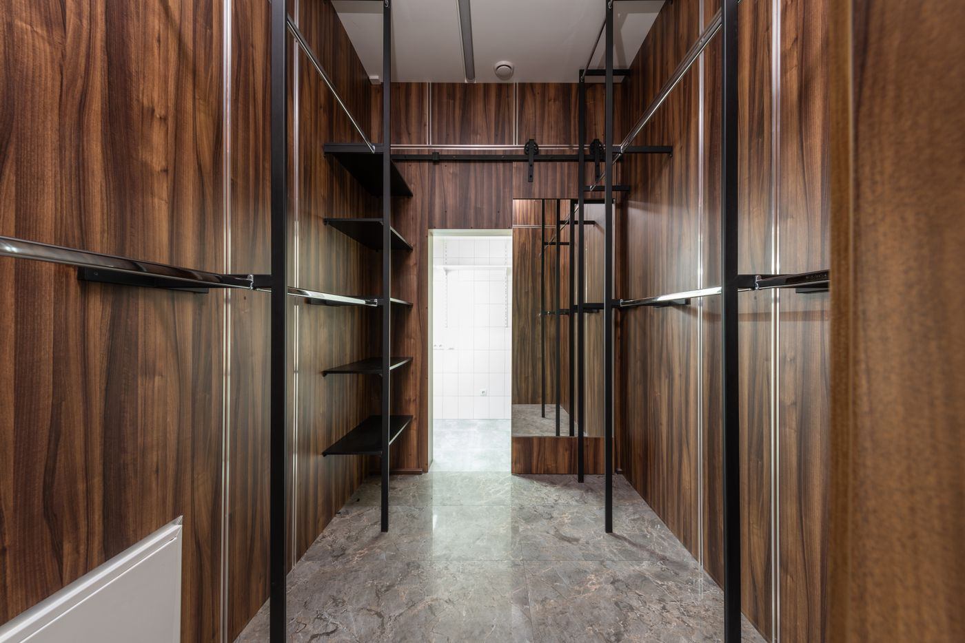 Walnut dressing room with black steel rails